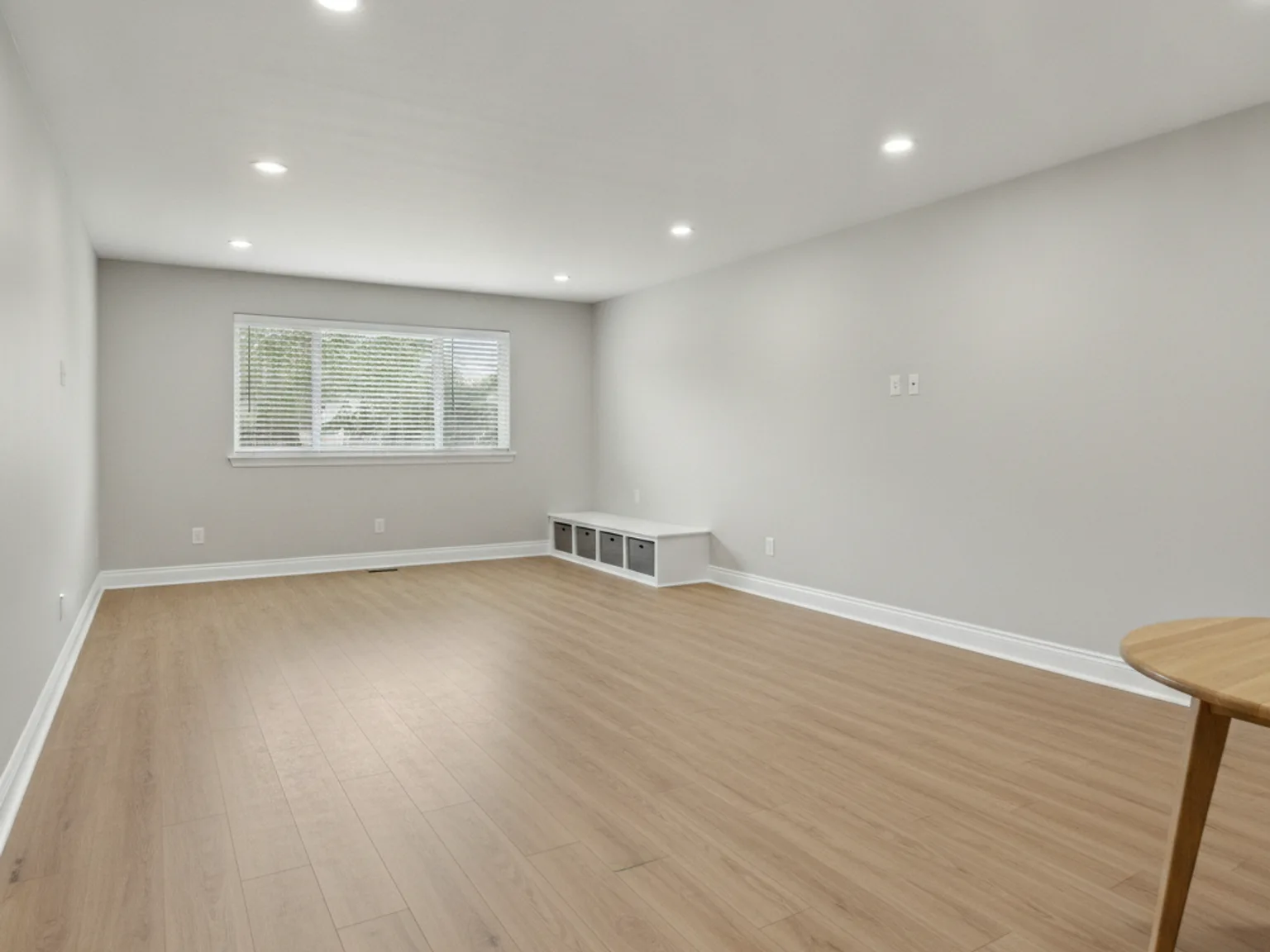 Garage conversion with new insulation, drywall, and flooring in a Kansas City home