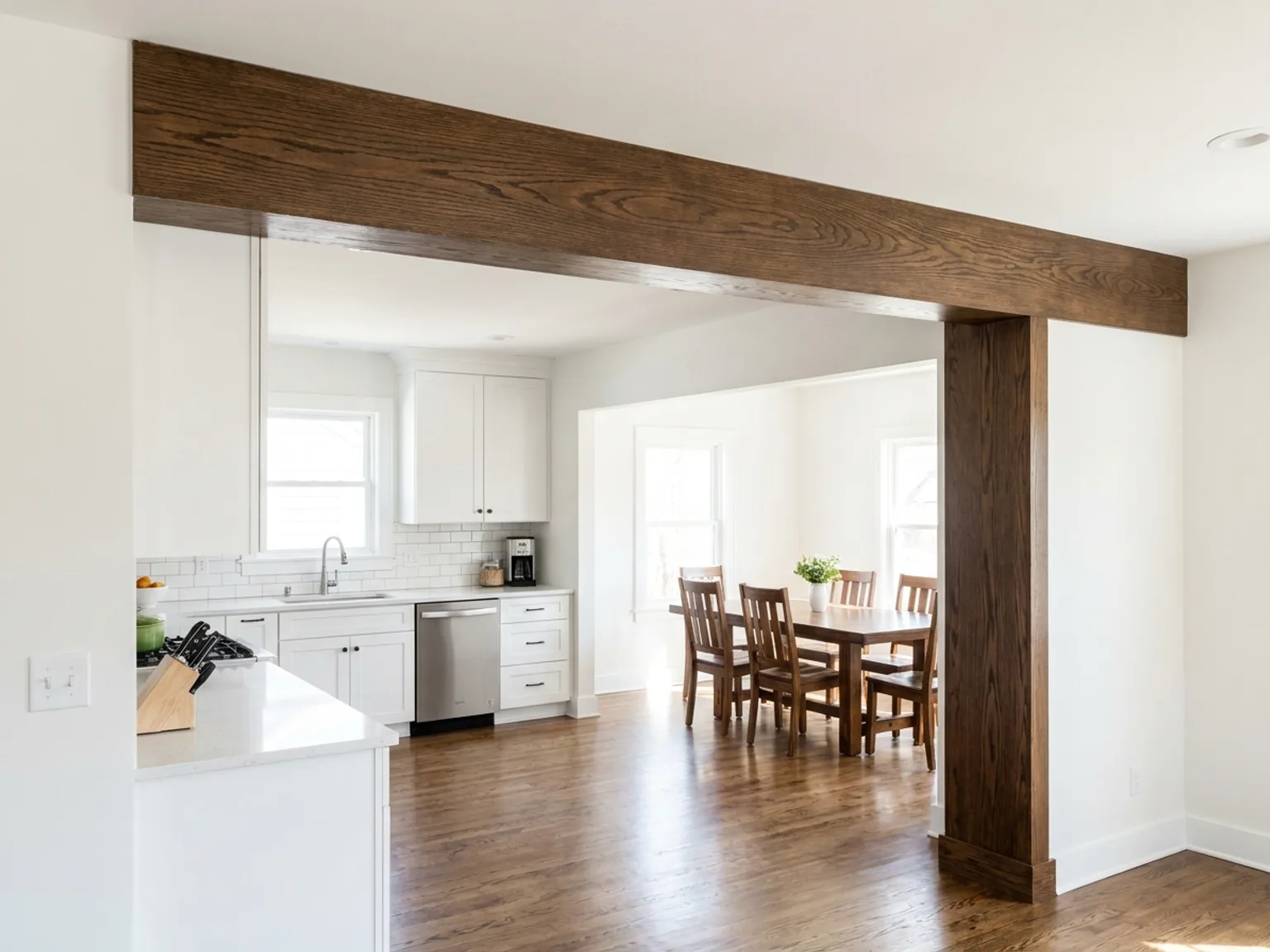 Wrapped structural beam and column detail after a wall removal in a Kansas City home