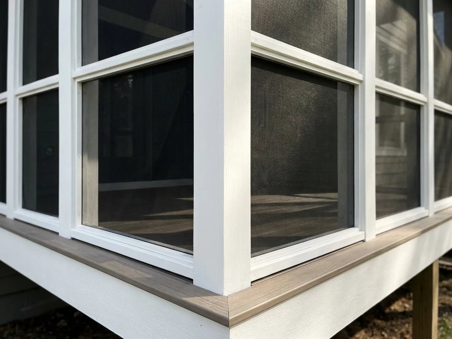 Detail of tight screen panels and painted trim on a new Kansas City screened porch